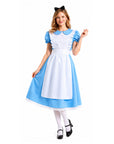 Woman modelling an Alice in Wonderland costume. She is wearing a blue dress with puff sleeves and an attached white apron with ruffle details. She's also wearing white stockings, black heeled shoes and a black bow headband.