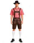 A man modeling a traditional German dirndl outfit, featuring a red and white gingham shirt, brown embroidered lederhosen, a black cowboy hat, white knee-high socks, and black dress shoes, set against a plain white background.