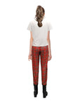 Person wearing a white t-shirt and red plaid pants on a white background