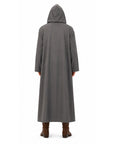 back view of a person wearing a grey cloak with hood up.