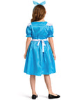 Child wearing a blue dress with a white belt on a white background