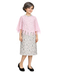 Young girl wearing a grandma costume with pink lace shawl top and floral dress on a white background