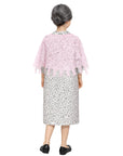 Young woman wearing a grandma costume of a floral dress with a pink shawl on a white background