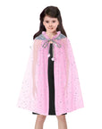 Child wearing a pink cape with decorative trim on a white background