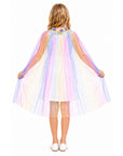A child viewed from behind wearing a sheer, iridescent tulle cape with pastel rainbow stripes and tiny reflective stars, posed against a plain white background.