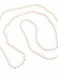 A strand of white freshwater pearls arranged in a loose spiral on a plain white background.