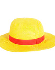 Yellow straw hat with a red band on a white background
