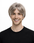 Person wearing a gray wig on a white background