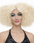 Woman wearing a blonde afro wig on a white background
