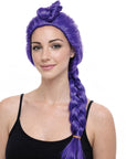 A woman with a bright purple wig styled in a high twisted bun with a long side braid, wearing a black tank top against a plain white background.
