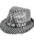 A black and silver polka-dot fedora hat with a black band around the crown that reads 'HAPPY NEW YEAR' in white letters, shown on a plain white background.