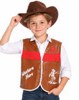 A young boy wearing a brown faux-leather Western vest with red fringe, a brown cowboy hat, a white collared shirt, and blue jeans, posing against a white background.