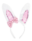 White bunny ears with pink sequin bow on a white background