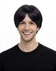 Person wearing a black wig on a white background