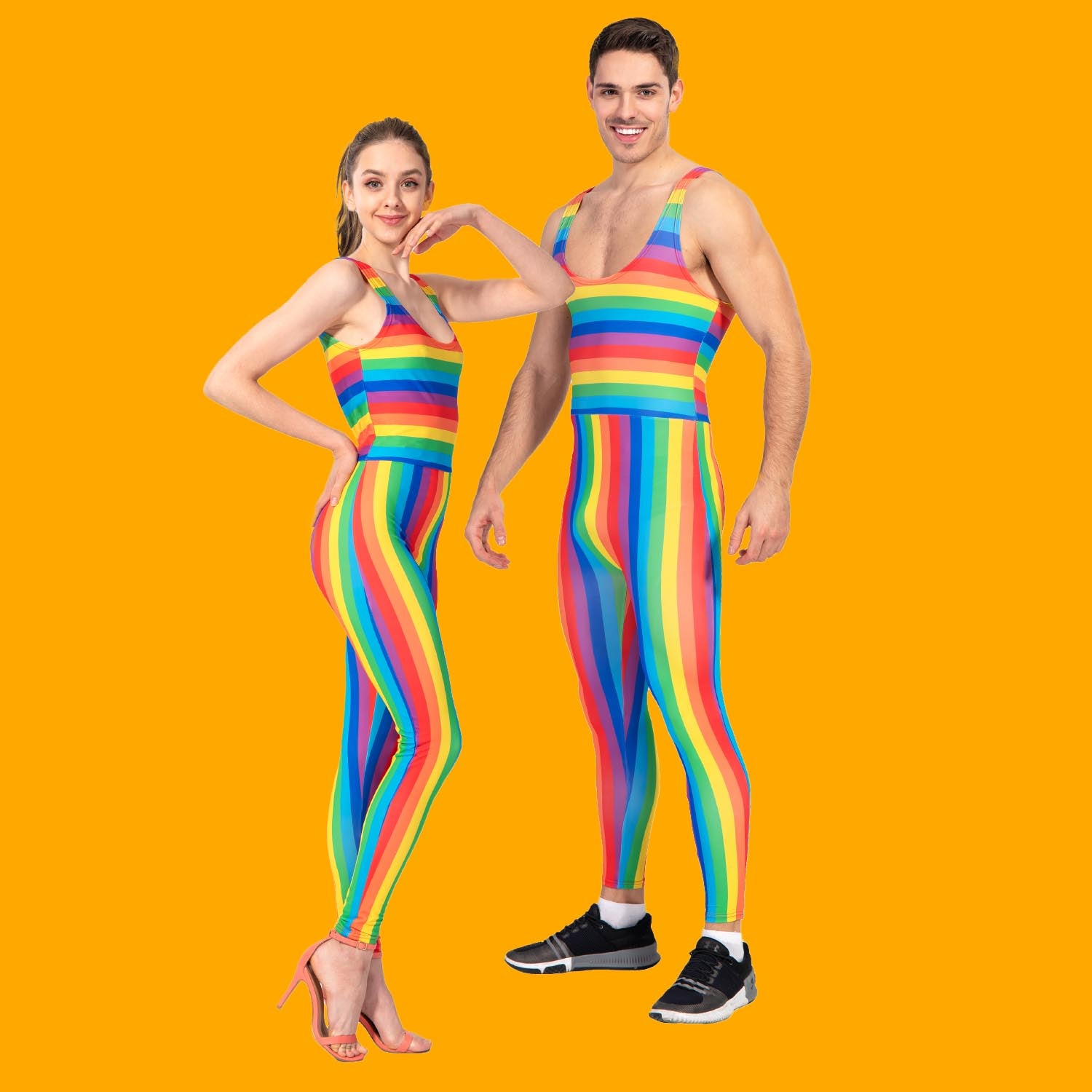 Two models wearing rainbow striped outfits on an orange background