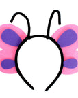 A children's butterfly headband featuring pink felt wings with purple centers and black elastic ear wires, shown on a plain white background.