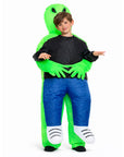 Child wearing a green and blue inflatable alien costume on a white background