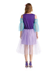 Woman wearing a purple dress with sheer sleeves on a white background