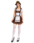 A woman modeling a traditional German dirndl costume against a plain white background. The costume includes a brown and white dress with embroidered details, a brown hat with a yellow feather, white thigh-high stockings, and black Mary Jane heels.
