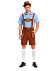 A man modeling a traditional German-style costume consisting of brown lederhosen shorts with embroidered details, a light blue checkered short-sleeve shirt, white knee-high socks, a brown fedora hat, and black dress shoes, set against a plain white background.
