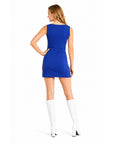 A woman shown from the back wearing a sleeveless royal blue mini dress and white knee-high heeled boots against a plain white studio background.