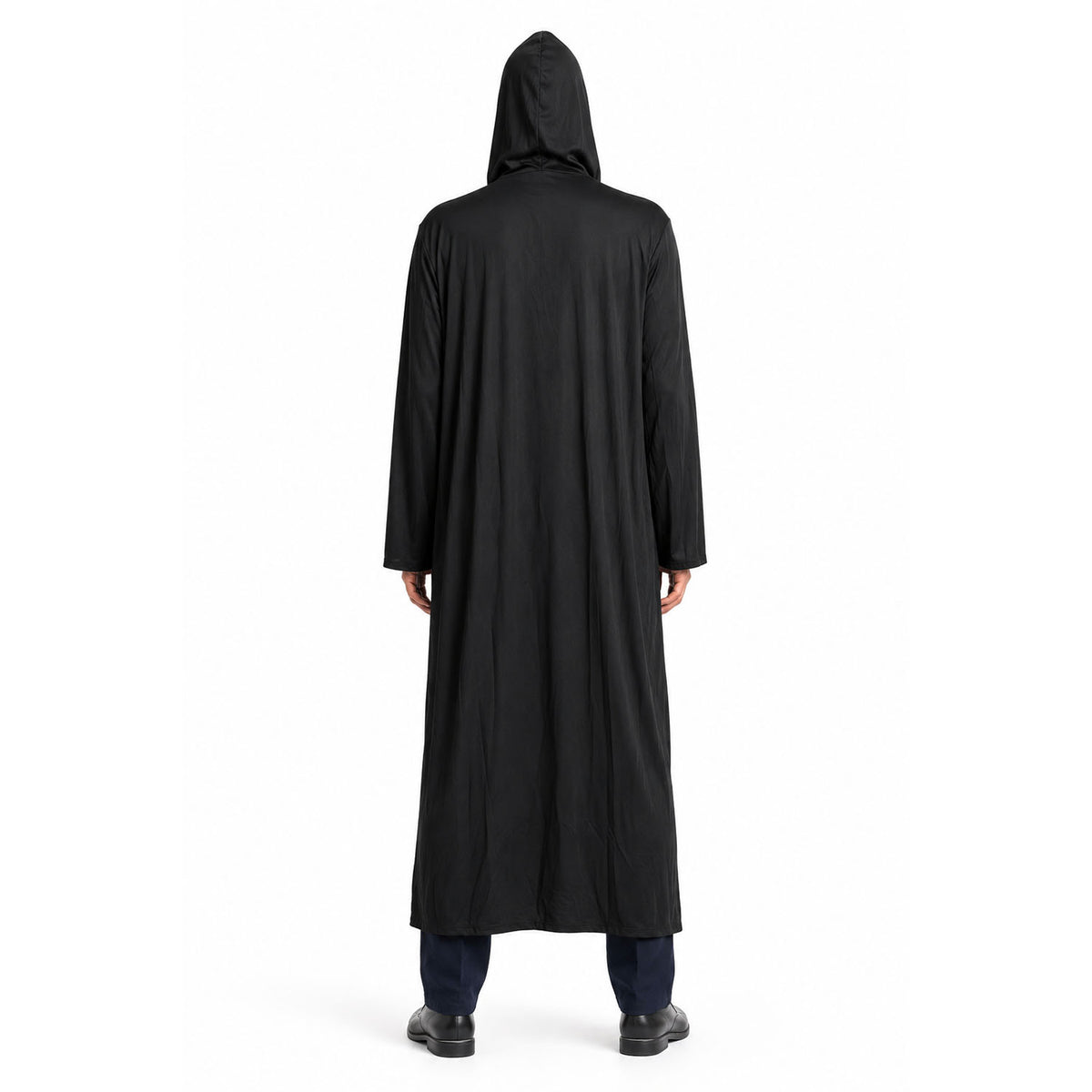 A person viewed from the back wearing a long black hooded robe or cloak over dark pants and black shoes, standing against a plain white studio background.