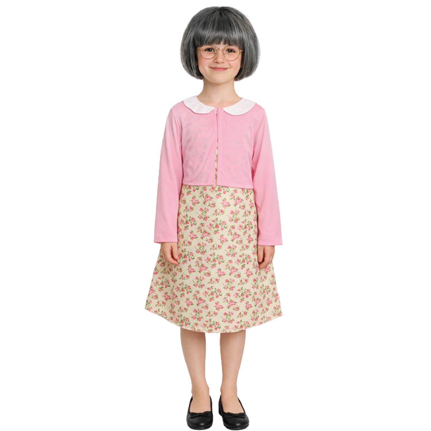 Child wearing a pink top and floral skirt on a white background
