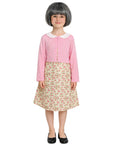 Child wearing a pink top and floral skirt on a white background