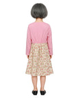 Person wearing a pink top and floral skirt on a white background
