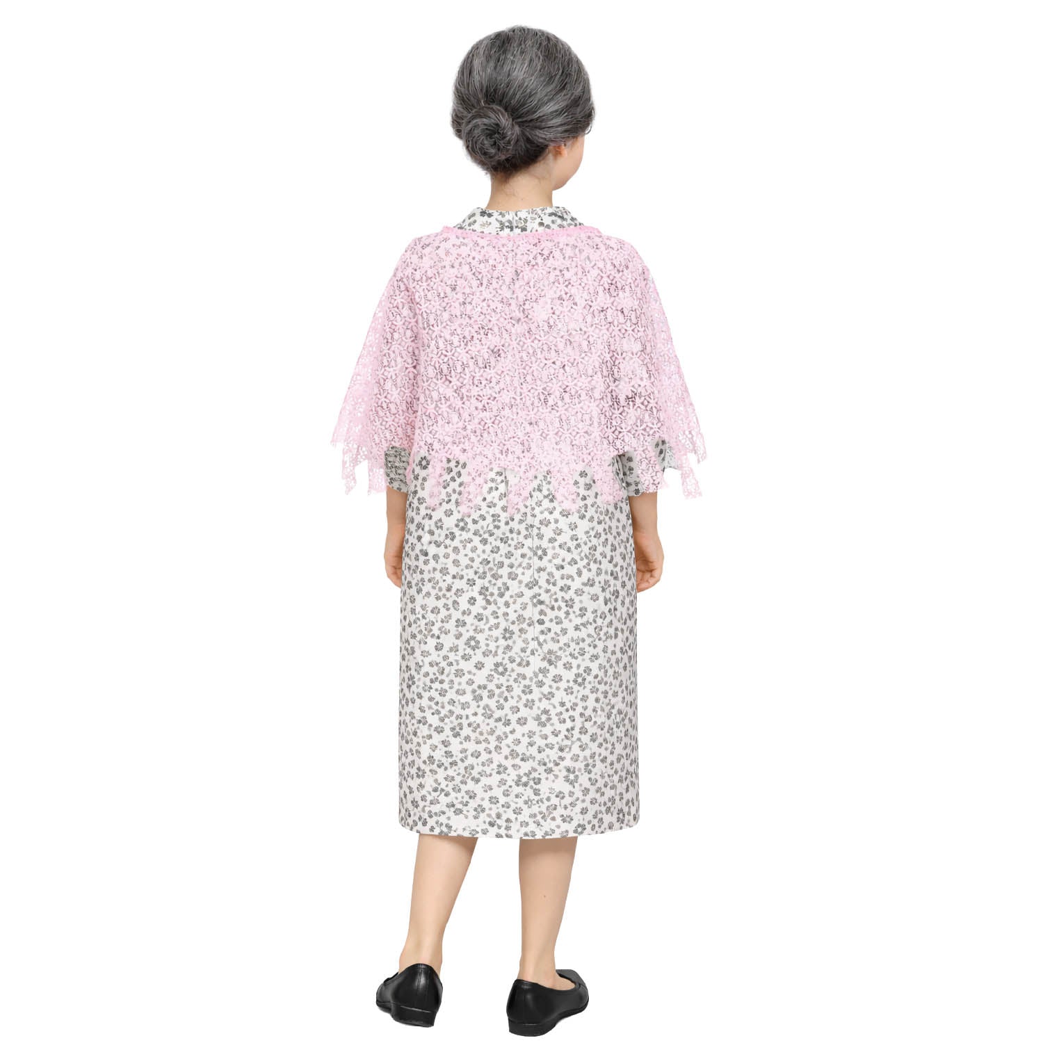 Young woman wearing a grandma costume of a floral dress with a pink shawl on a white background