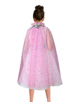 Pink cape with star patterns worn by a person on a white background