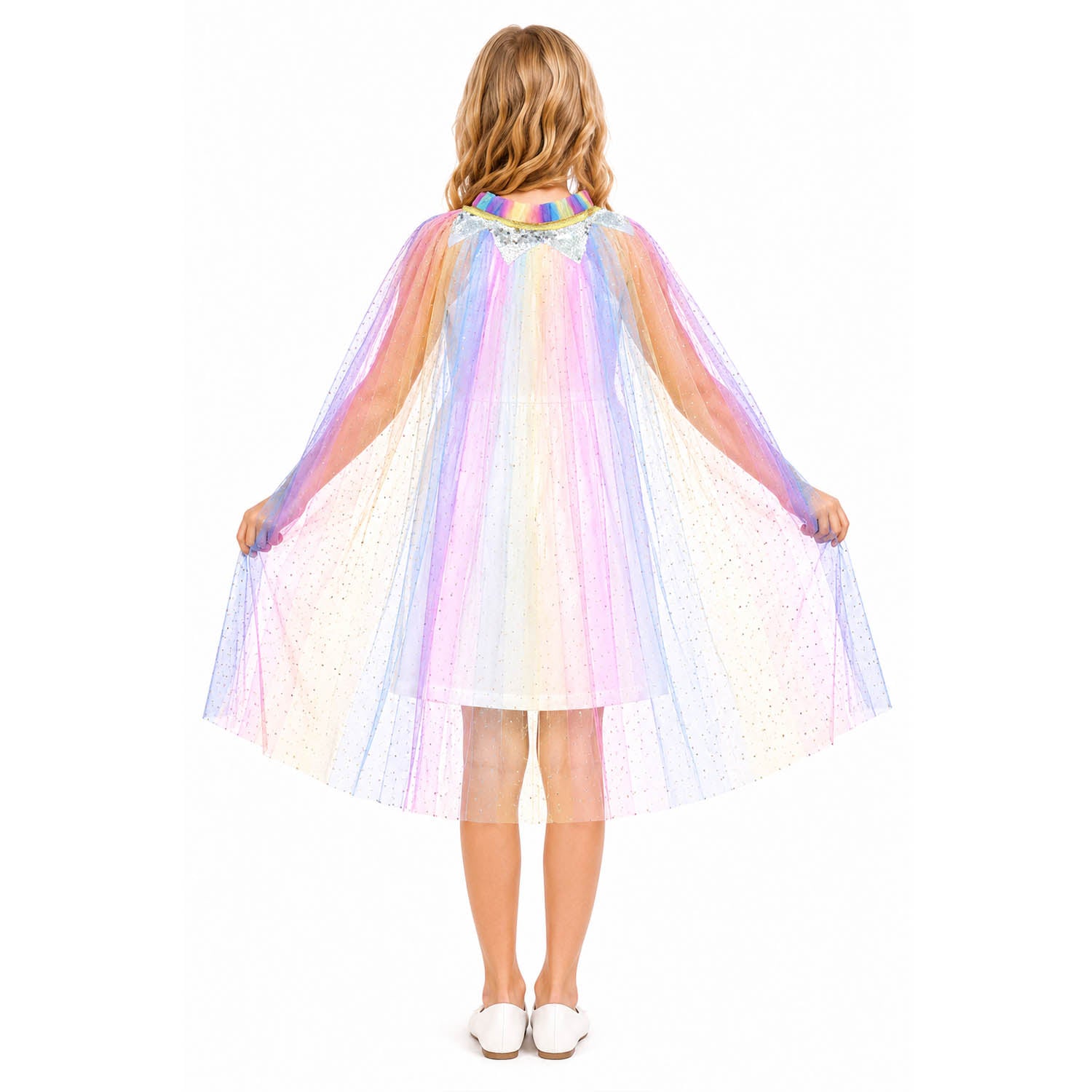 A child viewed from behind wearing a sheer, iridescent tulle cape with pastel rainbow stripes and tiny reflective stars, posed against a plain white background.