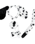 A black and white spotted faux-fur costume accessory set on a plain white background, including a long tail, a spotted headband with a black floppy ear, a round nose snout patch, and a bow tie.