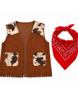 A children's brown faux-suede vest with cow-print trim and front pockets, shown next to a red bandana with white paisley print on a plain white background.