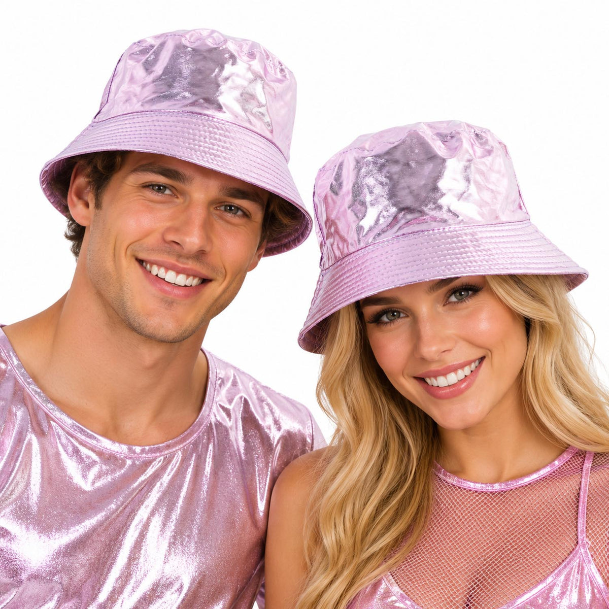 A man and a woman wearing shiny metallic pink bucket hats and matching pink tops, smiling against a plain white background.