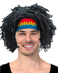 Person wearing a colorful headband and black wig with a white background