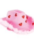 A pink felt cowboy hat decorated with red glittery hearts and trimmed with fluffy white faux fur, shown on a plain white background.