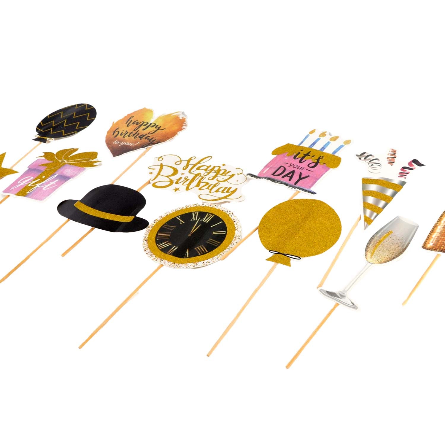 A set of birthday party photo booth props on wooden sticks, including a black top hat with a gold band, a gold balloon, a black clock face, a pink cake, a champagne glass, and other festive shapes, all displayed on a clean white background.