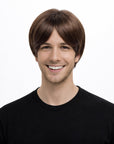 Person wearing a brown wig on a white background