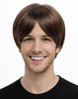 Man wearing a brown wig on a white background