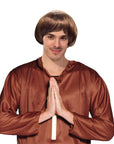 Person wearing a brown satin robe and wig on a white background