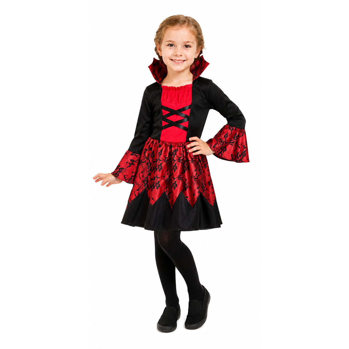 A young girl modeling a vampire costume dress with black and red fabric, featuring a ruffled collar, lace-up chest detail, patterned skirt, and black tights against a plain white background.