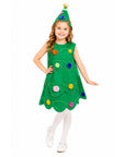 A young girl modeling a green Christmas tree costume dress with colorful felt ornaments and a matching pointed green hat with a star topper, photographed against a plain white background.