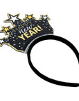 A black headband featuring a decorative crown-shaped party topper with the words 'Happy New Year!' in gold and white, surrounded by glittery stars on a white background.