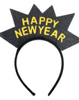 A black glittery starburst party headband with 'HAPPY NEW YEAR' written in yellow glittery letters, shown against a plain white background.