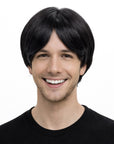 Person wearing a black wig on a white background