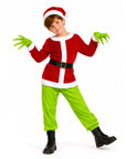 A child modeling a Grinch-inspired Christmas costume on a solid white background. The costume includes a red velvet long-sleeve top with white trim, bright lime green pants, green claw gloves, a red and white Santa hat, and a black belt with a silver buckle.